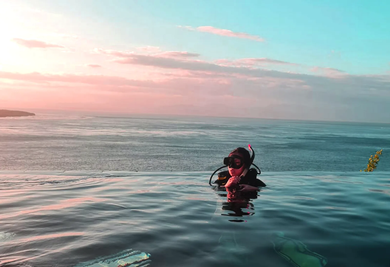 Scuba diver training in the infinity pool at Noosa Dive Resort